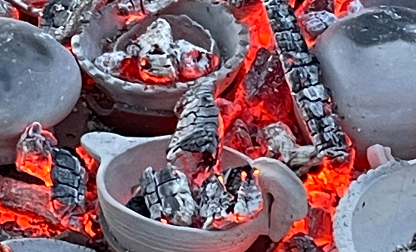 Image of clay pots with hot coals