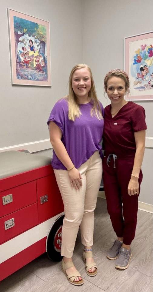 Jessica Criswell stand with Dr. Carpenter in an examination room while job shadowing