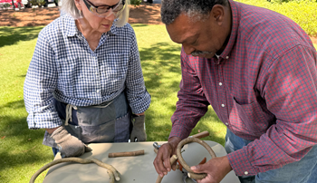 Andrew McCall demonstrating basket weaving