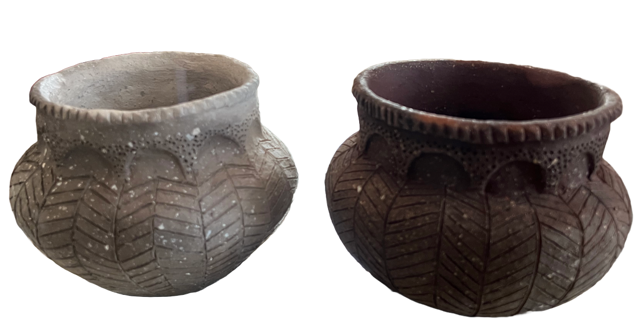 Two clay pots with lines carved on them