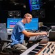 Student controlling sound equipment in the Lucky Man Studio