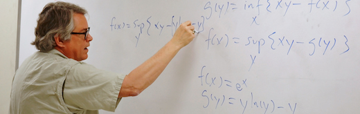 male faculty member at a whiteboard