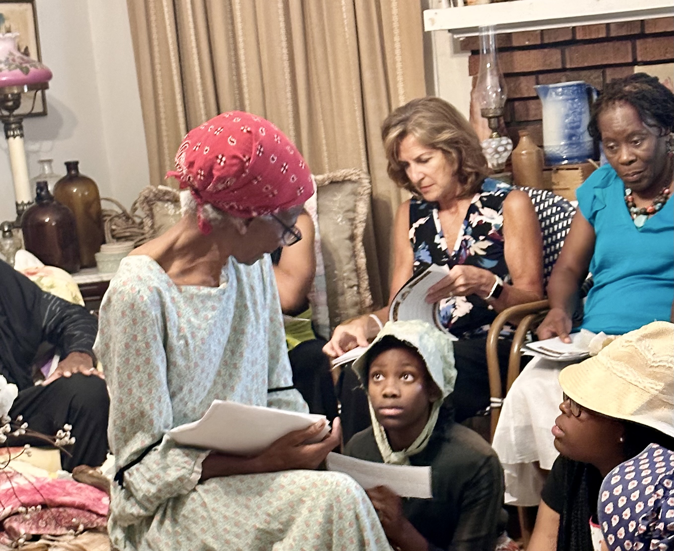 Betty Anderson reads to children and community members in her home