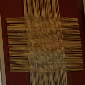 Muscogee Creek river cane mat on display at Pebble Hill
