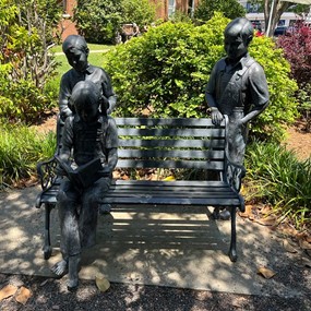 An iron statue showing Scout and Jem Finch with friend Dill Harris commemorates the legacy of Harper Lee's "To Kill A Mockingbird" outside the Monroe County Courthouse in Monroeville, Alabama.