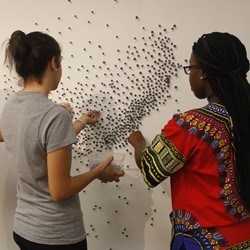 Students building an exhibit in the gallery