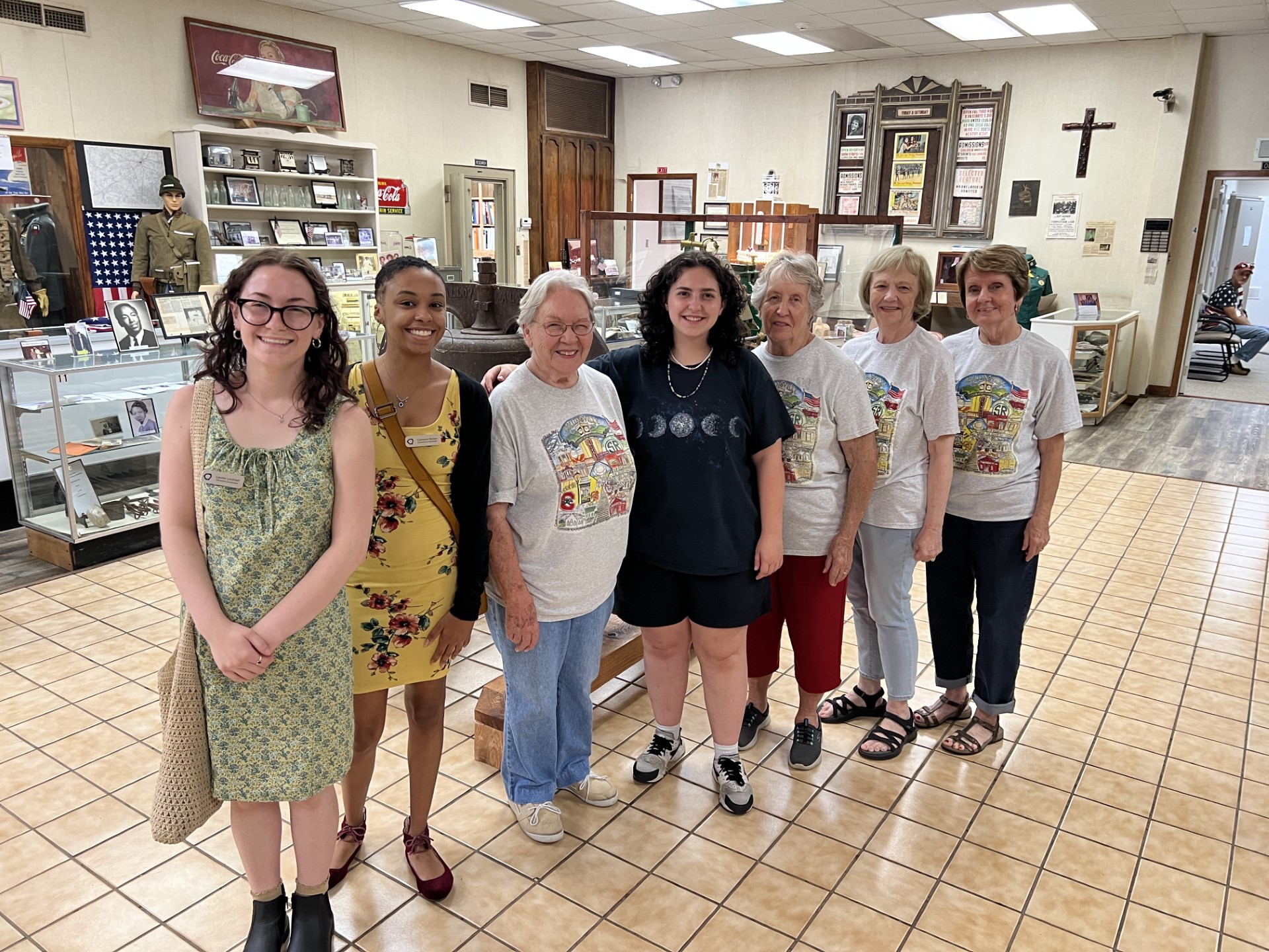 7 women stand in the lobby of the Collinsville museum
