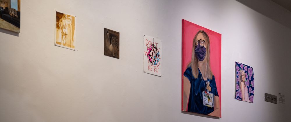 Student artworks on the wall of Biggin Gallery