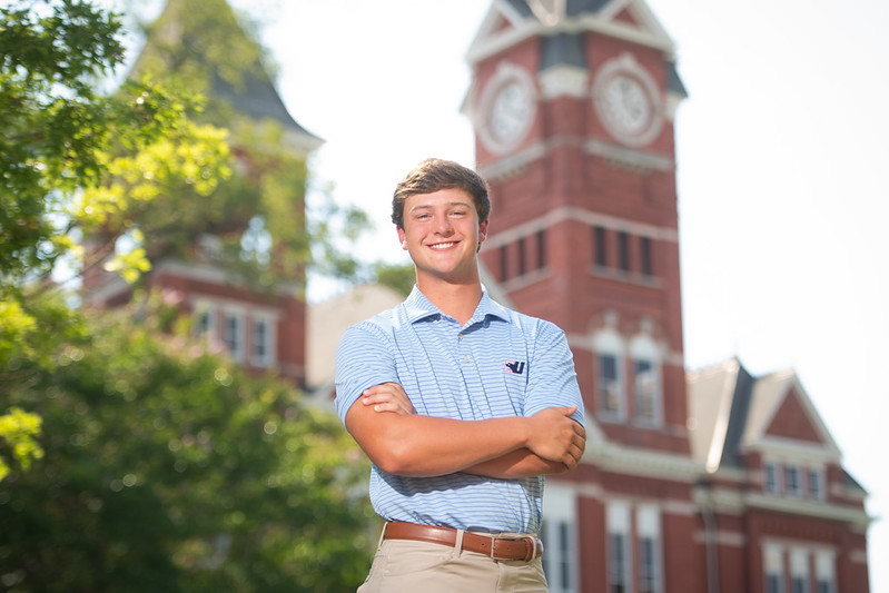 Jake Haston stands in front of Samford Hall