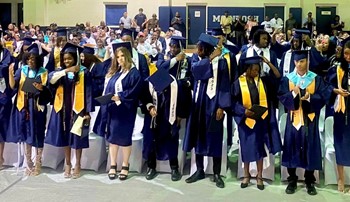 McIntosh High School's class of 2023 celebrate in graduation attire