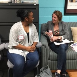 Student and Teacher talking