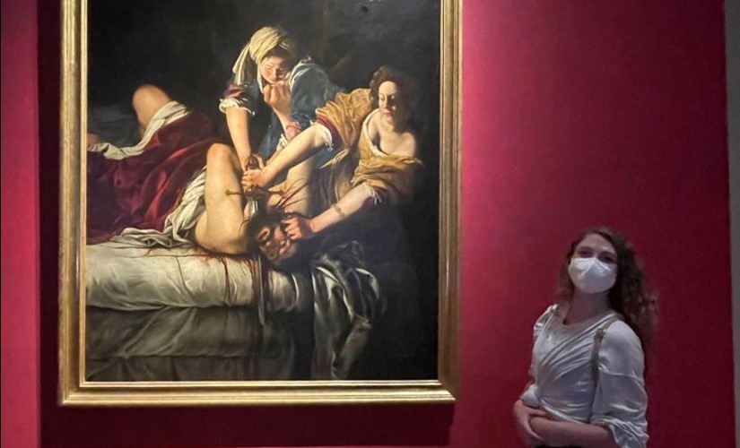 Sarah Walker standing in front of baroque painting