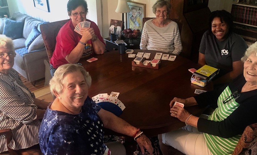 A group of Living Democracy participants playing cards