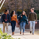 Students walking across Auburn's campus on the cover of the College of Liberal Arts Define Your Future 2023 Viewbook