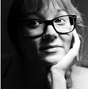 head shot photo of women in black and white